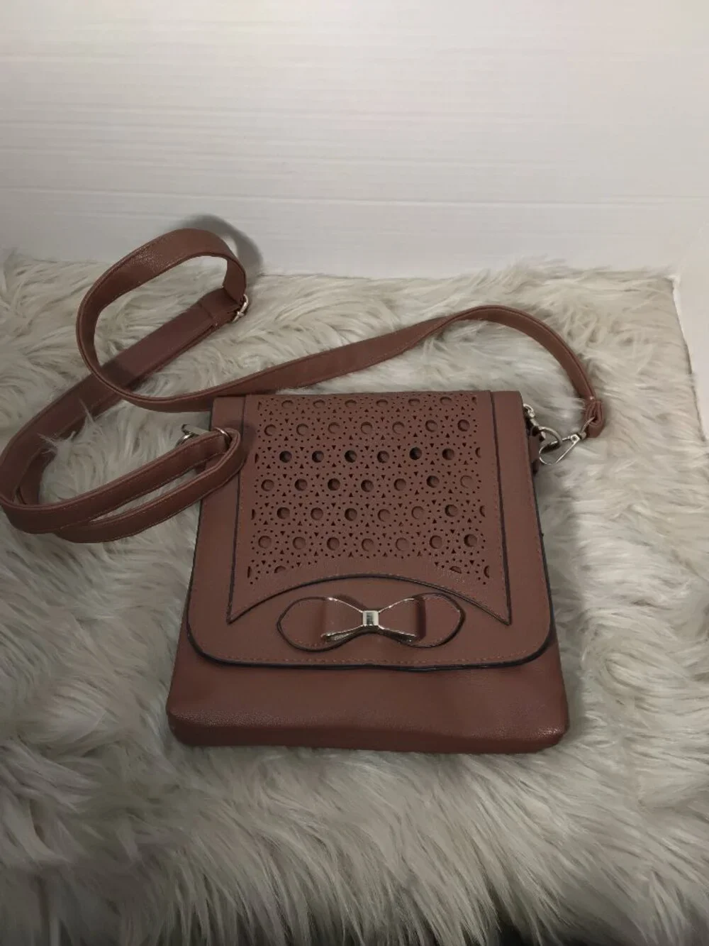 Brown Leather Handbag – Perforated Front & Bow Accent
